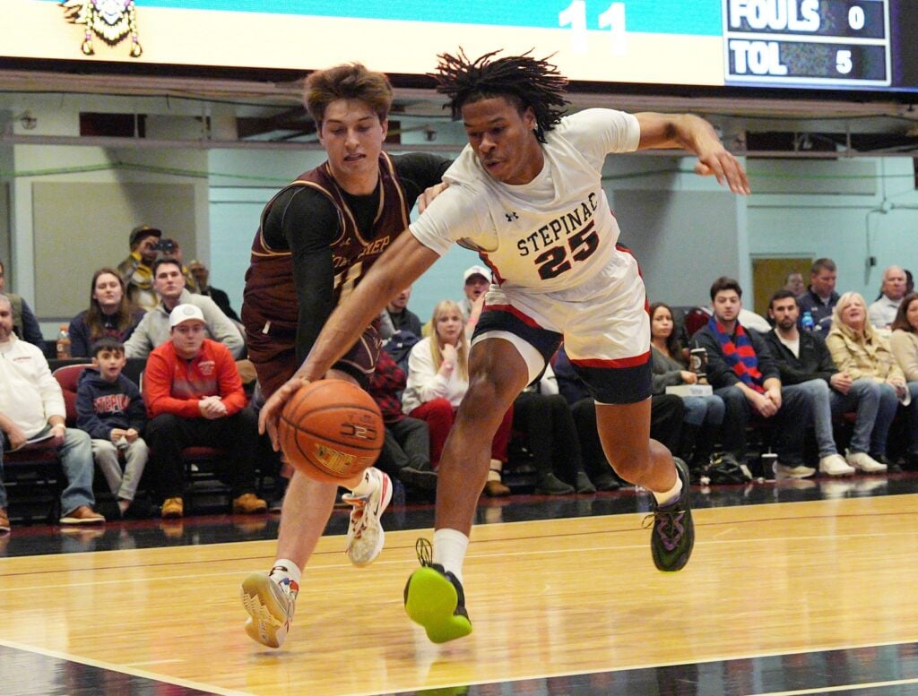 Stepinac's Jasiah Jervis (25) and Iona's Joe Wolf (11) battle for a loose ball during the Crusader Classic at the Westchester County Center in White Plains Jan. 4, 2025. © Frank Becerra Jr./The Journal News / USA TODAY NETWORK via Imagn Images
