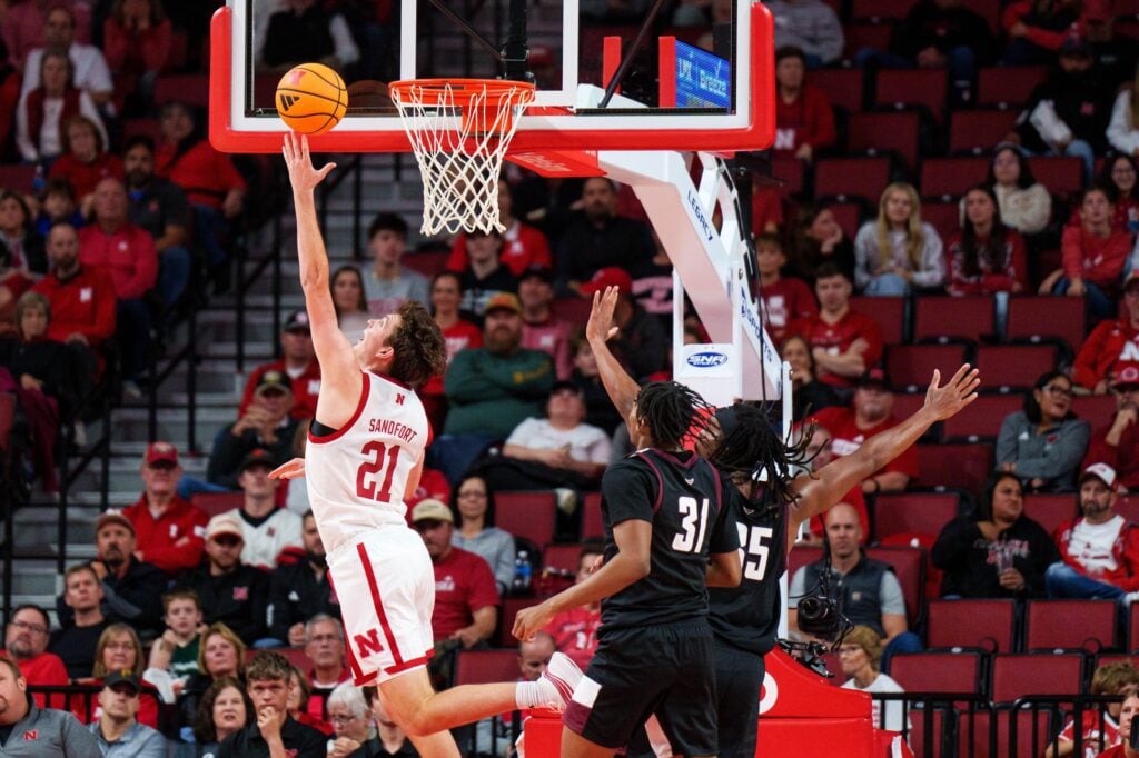 Nebraska Cornhuskers forward Pryce Sandfort (21) shoots the ball against Maryland Eastern Shore Hawks forward Maurio Hanson Jr. (31) and forward Christopher Flippin (35) during the second half at Pinnacle Bank Arena.