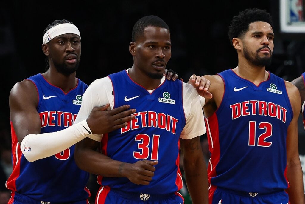 Teammates Detroit Pistons forward Tobias Harris (12) and guard Caris Levert (8) go over to guard Javonte Green (31) after he was called for a technical foul against the Boston Celtics during the second half at TD Garden.