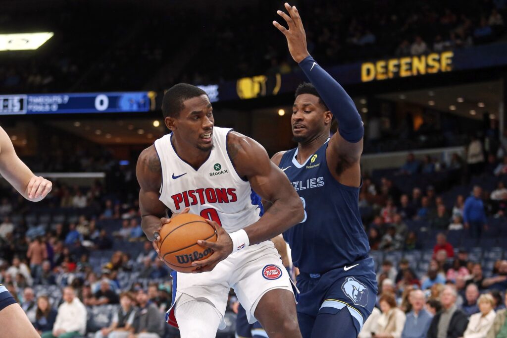 Nov 3, 2025; Memphis, Tennessee, USA; Detroit Pistons center Jalen Duren (0) drives to the basket as Memphis Grizzlies forward/center Jaren Jackson Jr. (8) defends during the first quarter at FedExForum. Mandatory Credit: Petre Thomas-Imagn Images
